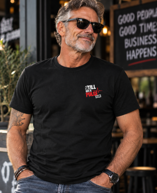 The Still Got A Pulse Club t-shirt with the small chest logo
